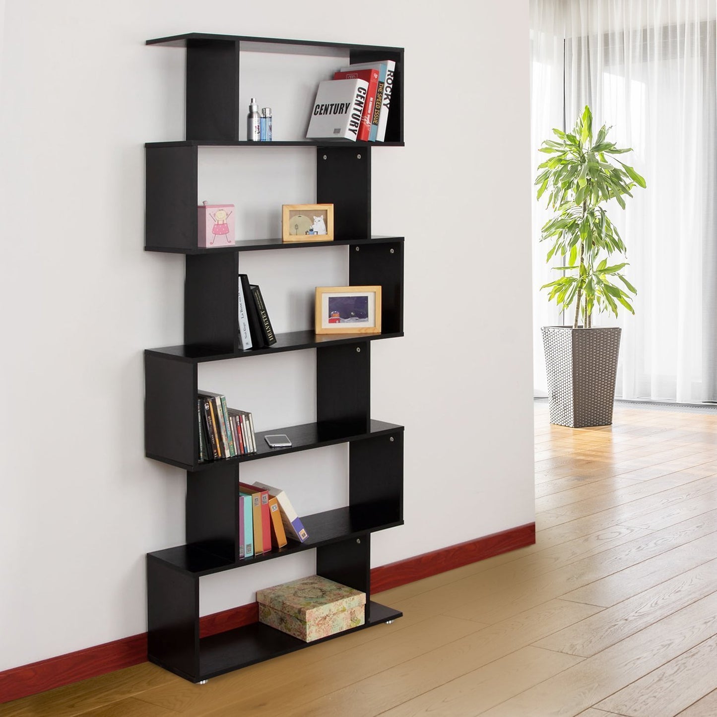 Six-shelf S-shaped wooden bookcase against a wall