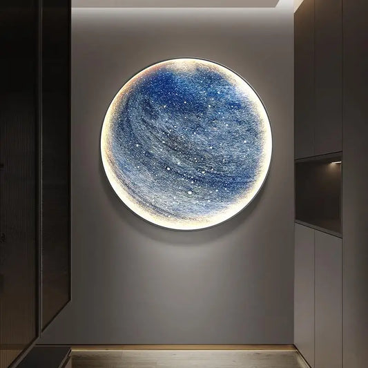 Circular LED moon wall light mounted above a bed