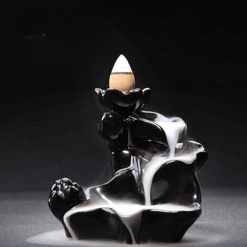 Ceramic backflow incense burner with smoke falling like a waterfall