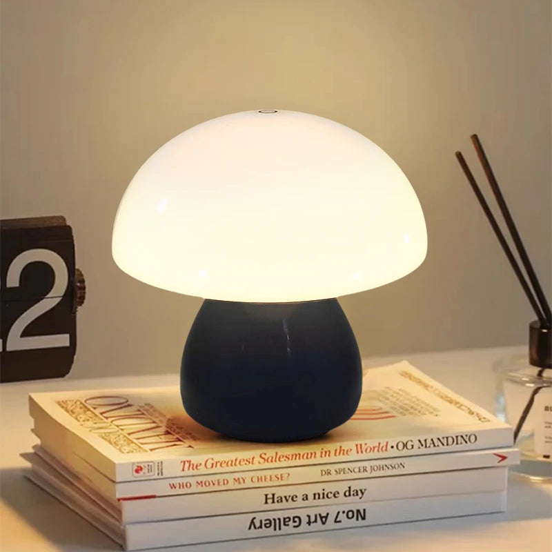 Cordless mushroom-shaped LED table lamp glowing warm white